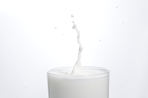 Drop in glass of milk