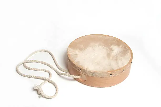 Wooden hand drum with rope isolated