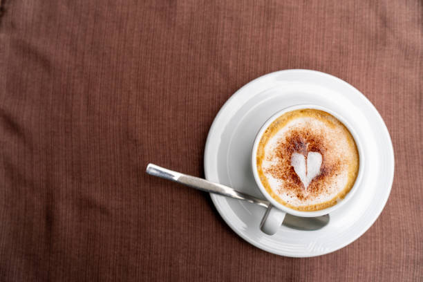 Top view of Latte coffee or cappuccino coffee in white cup with beautiful tree latte art