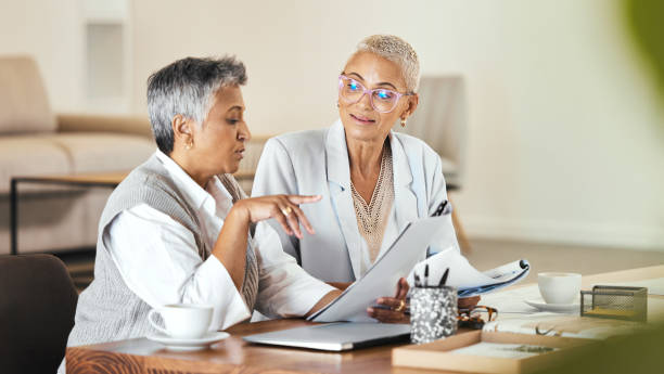 istock Partnership, documents and elderly women partners in office for planning, thinking and financial review. Business people, owner and senior b2b proposal with paper, research and budget analysis 1470257179