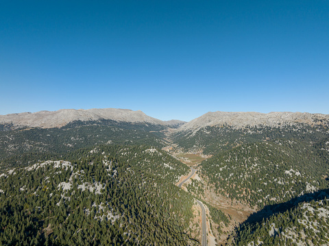 Aerial view of winding road between mountains. Antalya, Türkiye. Taken via drone.