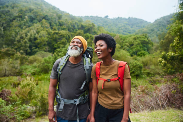 istock Smiling couple enjoying a scenic view during a hike 1470258606
