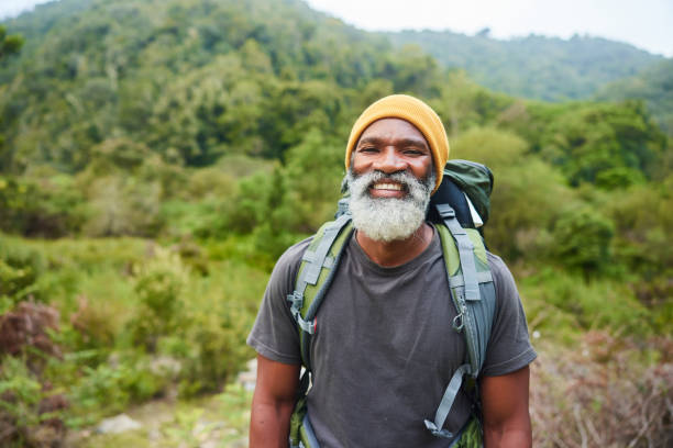 istock Mature man smiling during a hike alone in scenic hills 1470259321