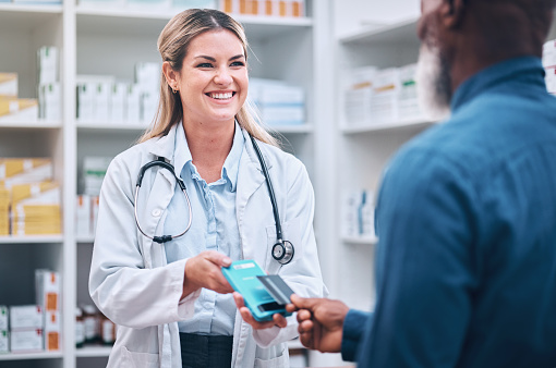 Pharmacist, payment or customer with credit, services medicine or buying. Pharmacy, woman or black man pay for pills, medical treatment or paying for prescription, clinic dispensary or pharmaceutical