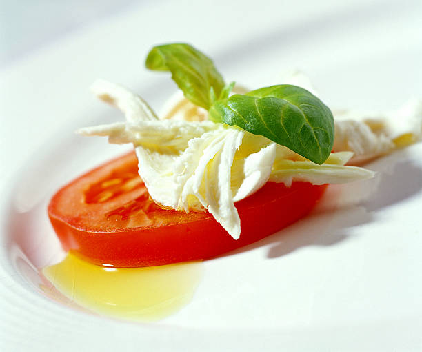 mozarella cheese with tomato slice stock photo