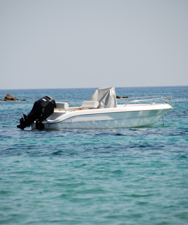 Motorboat parked in the aegean sea, nearby the coastline of Skiathos.