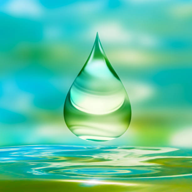 beautiful falling golden water drop or oil drop over smooth wavy water surface in saturated colors in sunlight, beauty care concept for cosmetics and wellness, bathroom wallpaper