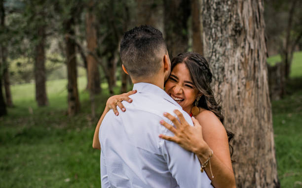 wedding couple, getting engaged outdoors, in green areas of Colombia, couple close to their wedding