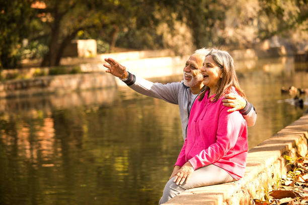 istock Old couple admiring view from lakeshore 1470265547