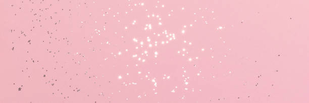 istock Sparkling silver glitter on pink background banner 1470268827