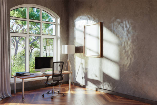 istock comfortable workplace with pc standing on wooden desk in office at home; bright sunlight shines from side through large window; wall with canvas copy space;  remote work freelance concept; 3D Illustration 1470269991