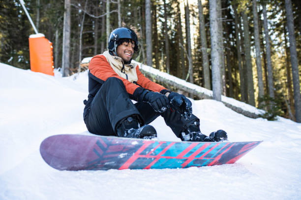 istock A young multiracial snowboarder putting on gloves 1470270148