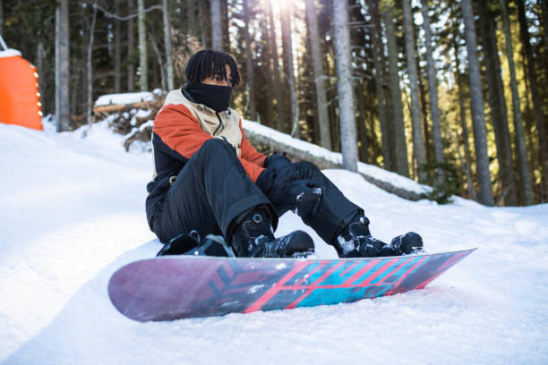 istock A young multiracial snowboarder getting ready for the slopes 1470270206