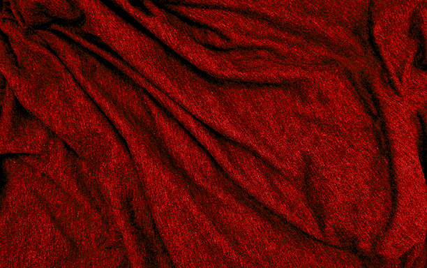 istock close up ripple red fabric cloth background texture. crumpled luxurious red fabric background and texture. abstract sensual background, empty template. selective focus. christmas background. 1470271115