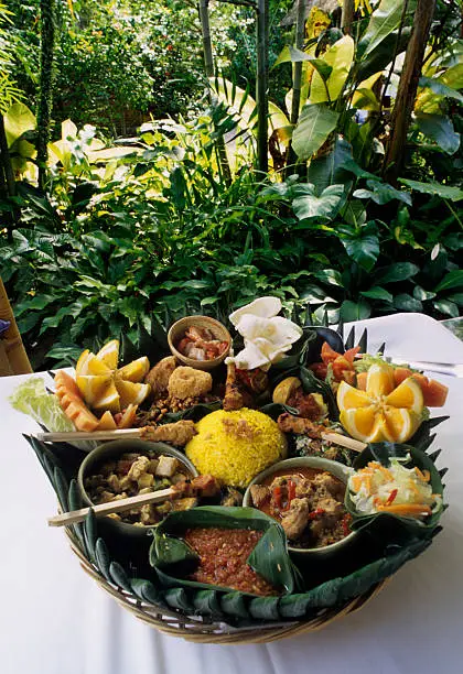 Photo of Indonesian Rijstaffel against Tropical Green Backdrop, Bali, Indonesia