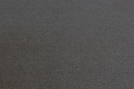 Texture of a woolen gray rug