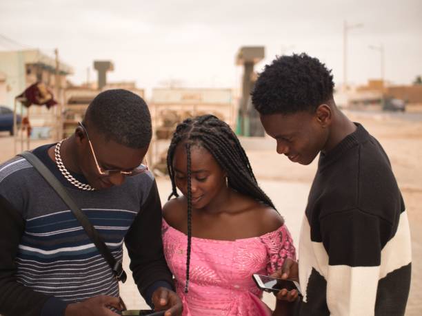 istock African friends looking the smartphone 1470272329