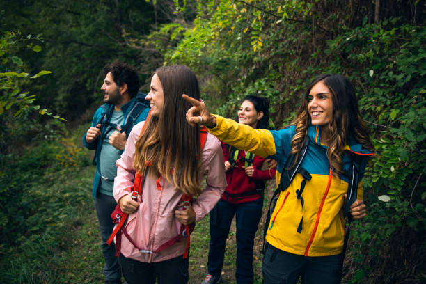 istock Four friends hiking in mountain together 1470272524