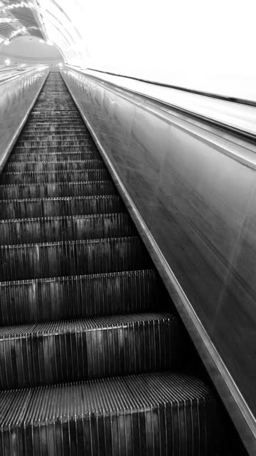 Skewed perspective of going up by metro escalator
