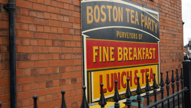 This old fashioned wall sign on a red brick facade is advertising a local cafe located in St. Gregory’s Hall in Stratford upon Avon.