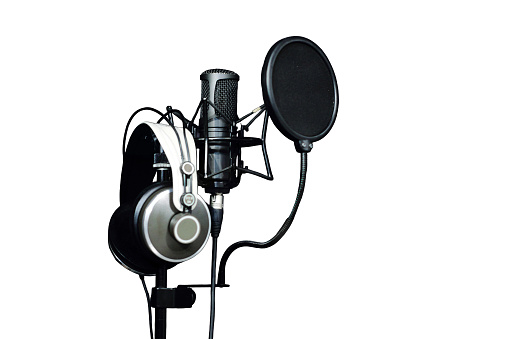 Podcast studio with audio, recording equipment, and technology.