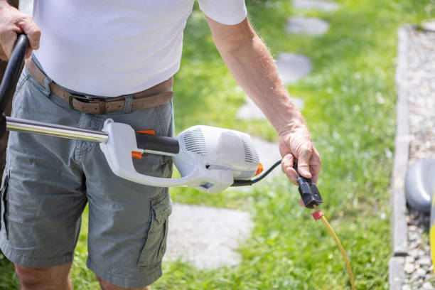 istock Senior man fixing lawn mower 1470275378