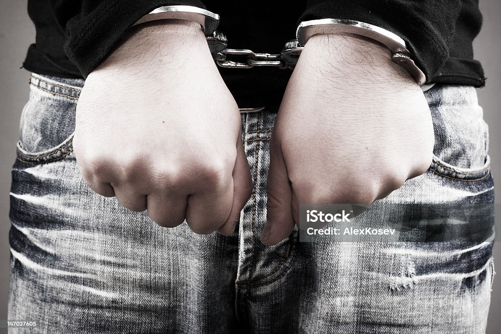 arrest Handcuffs on the man's hands Adult Stock Photo