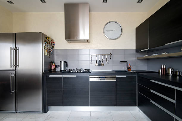 Interior of modern kitchen with black cabinets stock photo