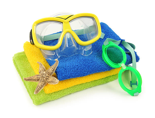 istock Towels and goggles with a starfish for a beach swim 147027790