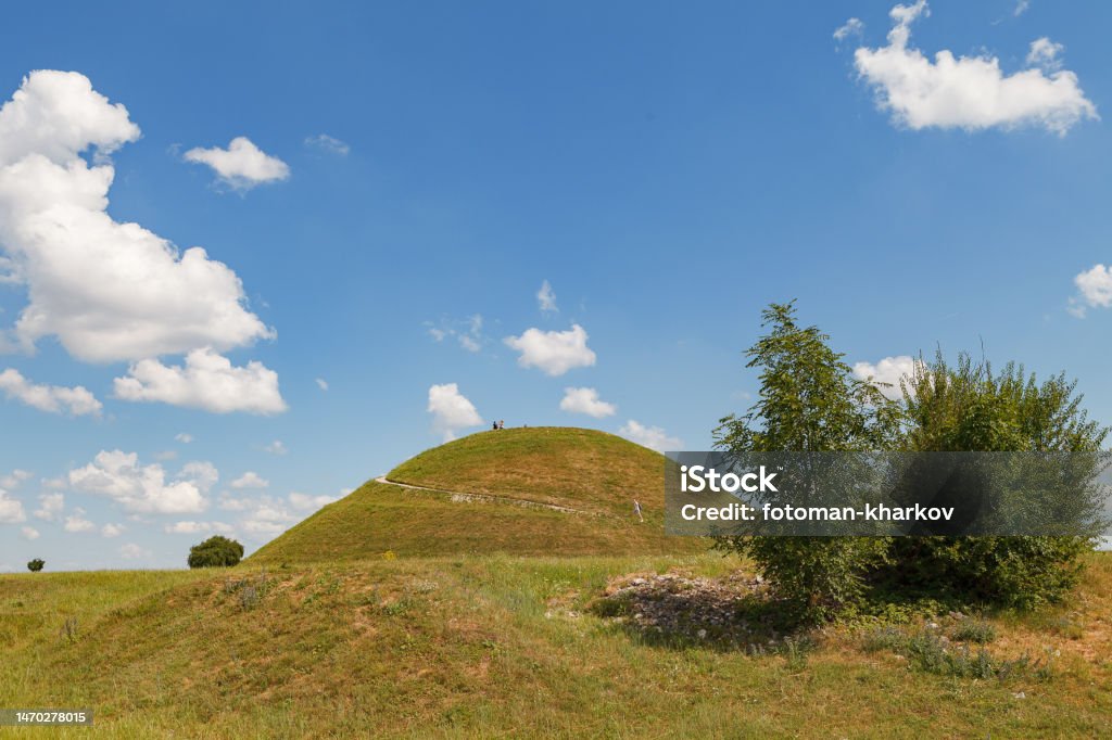 Ideal green round hill and blue sky with clouds above it. Krakus Mound, Krakow, Poland. Ancient Stock Photo