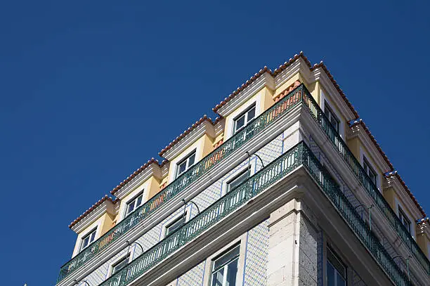 view on top of a house in Lissabon with blue sky in background