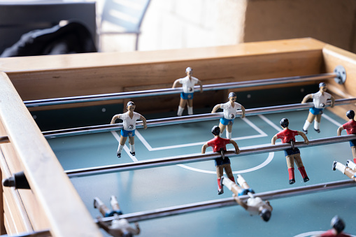 Close up of some red and white table football figures. Concept of family fun time