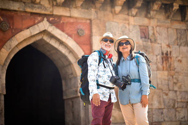 istock Old couple tourist looking up at ancient architecture 1470280608