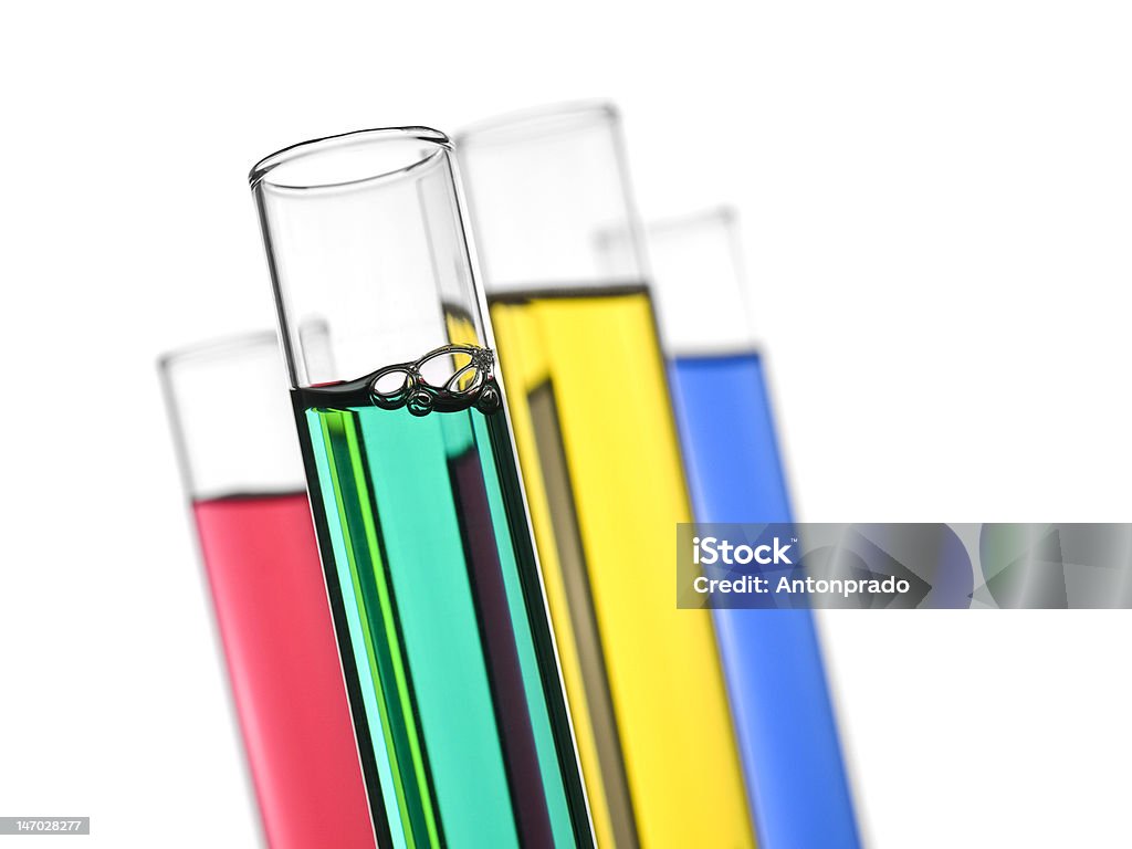 Test tubes Four test tubes filled with colored liquids. Isolated on white. Blue Stock Photo