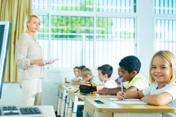 istock School girl working at lesson in classroom 1470283101