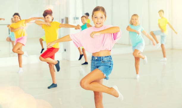 istock Young girls and boys performing dance in studio 1470283813