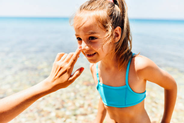 istock Mother applying suntan lotion on daughter 1470284599