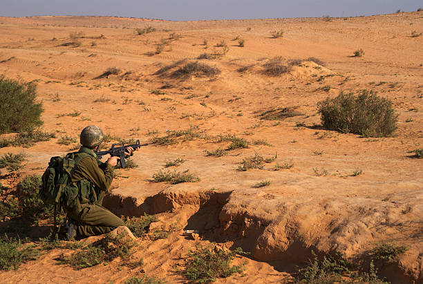 Israeli soldiers excersice in a desert stock photo