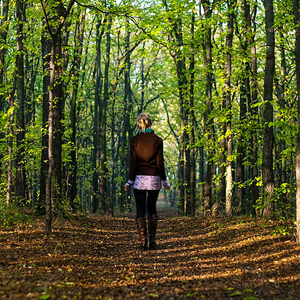 Girl in the woods stock photo