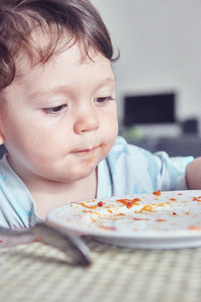 istock Toddler eating food 1470291018