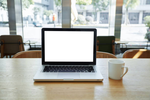 istock A laptop with a blank screen on a coffee table 1470292250