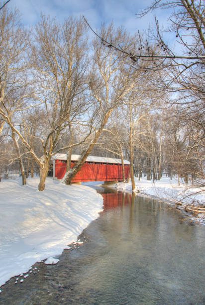 istock Red Covered bridge in the Snow-Howard County, Indiana 1470294142