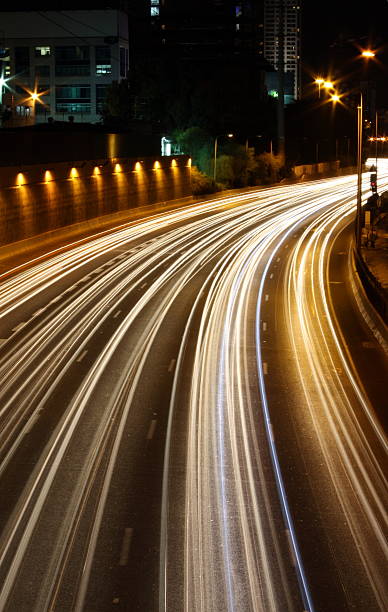 istock light trails of traffic on Ayalon highway at night 147029478