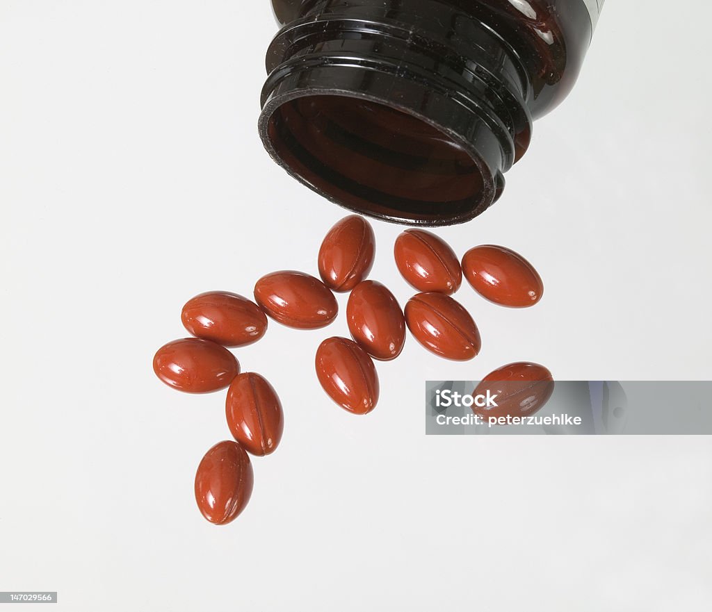 Arancione pillole - Foto stock royalty-free di Capsula