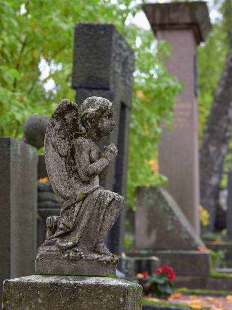 istock Old sculpture in European cemetery. 1470296464
