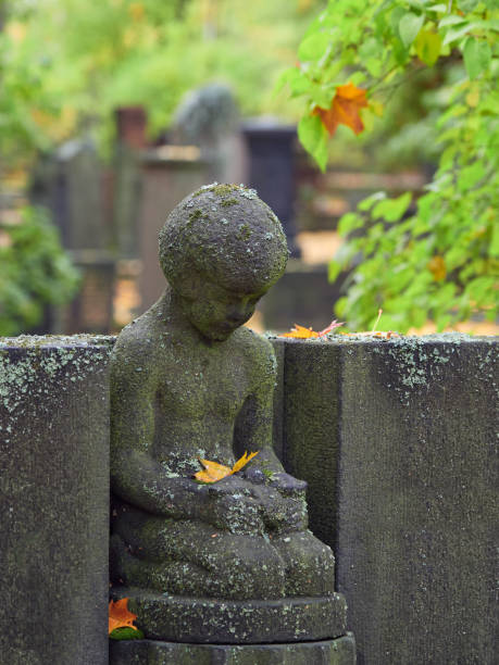 istock Old sculpture in European cemetery. 1470296497