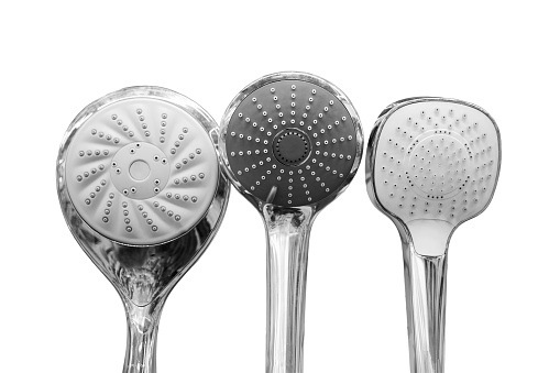 Sale of shower heads in a store, close-up, isolated on a white background
