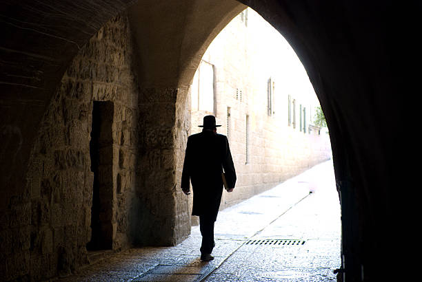 Rabbi commute in Jerusalem Rabbi walking through a tunnel in Jerusalem. rabbi photos stock pictures, royalty-free photos & images