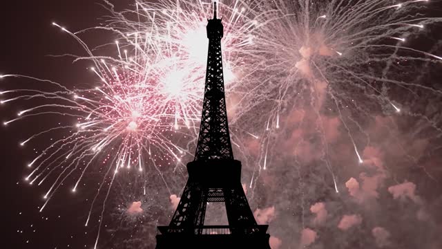 Celebratory colorful fireworks over the Eiffel Tower ( time lapse, with zoom)  in Paris, France