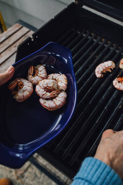 istock taking prawns off the barbecue grill 1470301370